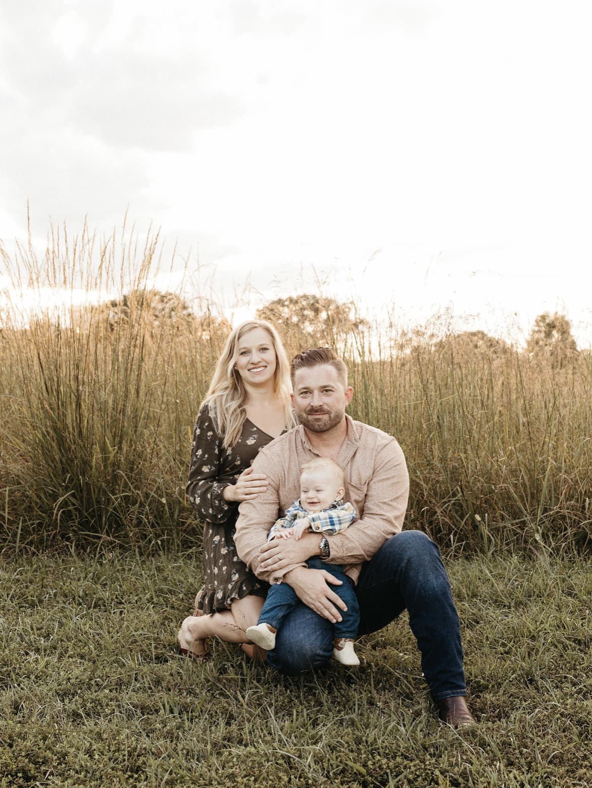 family taking a photo in the fields