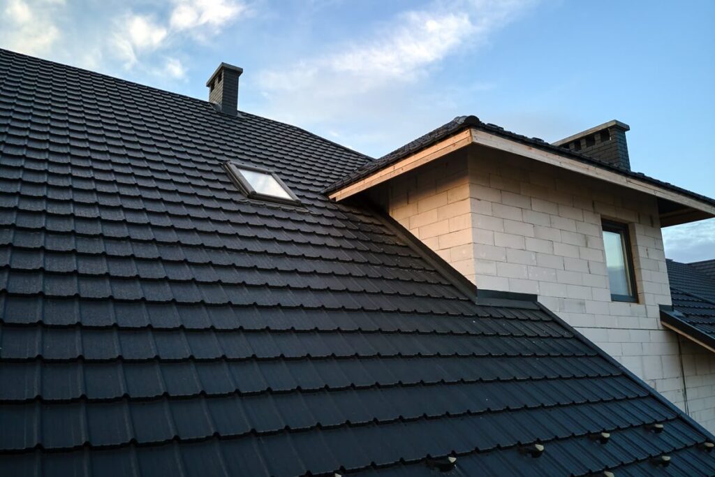 closeup of house roof top covered with ceramic shingles