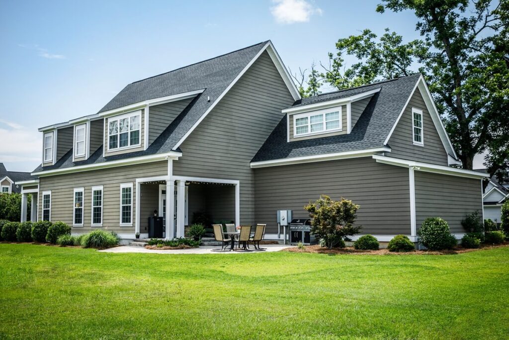 craftsman cottage style modern suburban house in subdivision with curb appeal