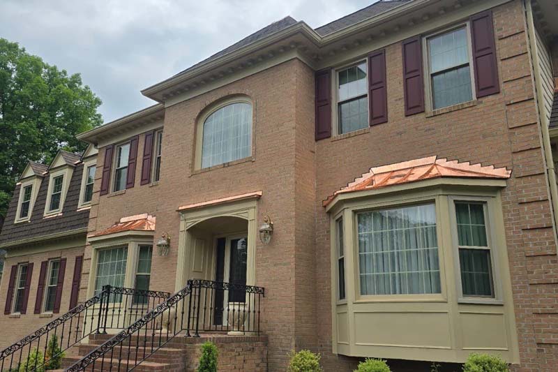 front of a house that was renovated by Pure Roofing