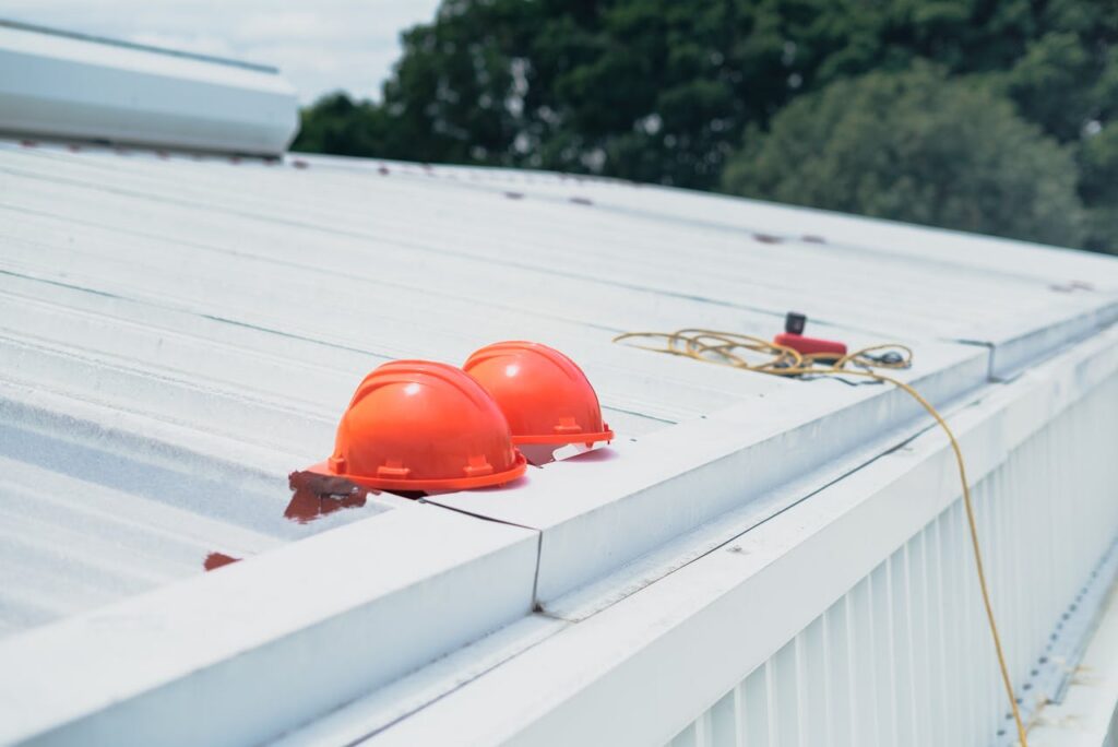hard hats and safety equipment on a metal roof