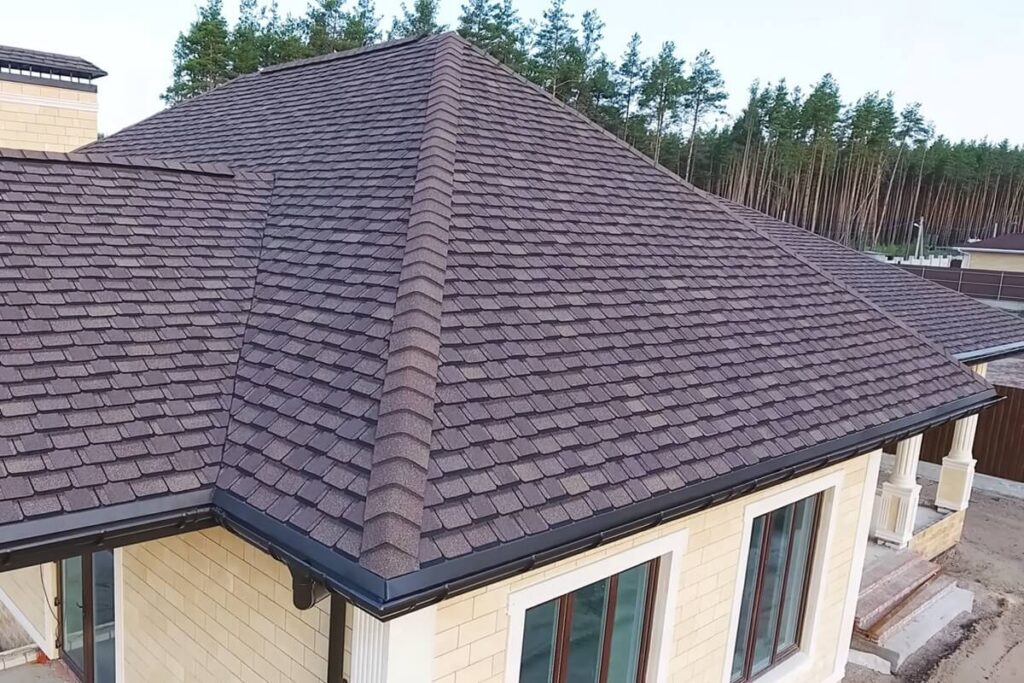 house with a roof from a bituminous tile