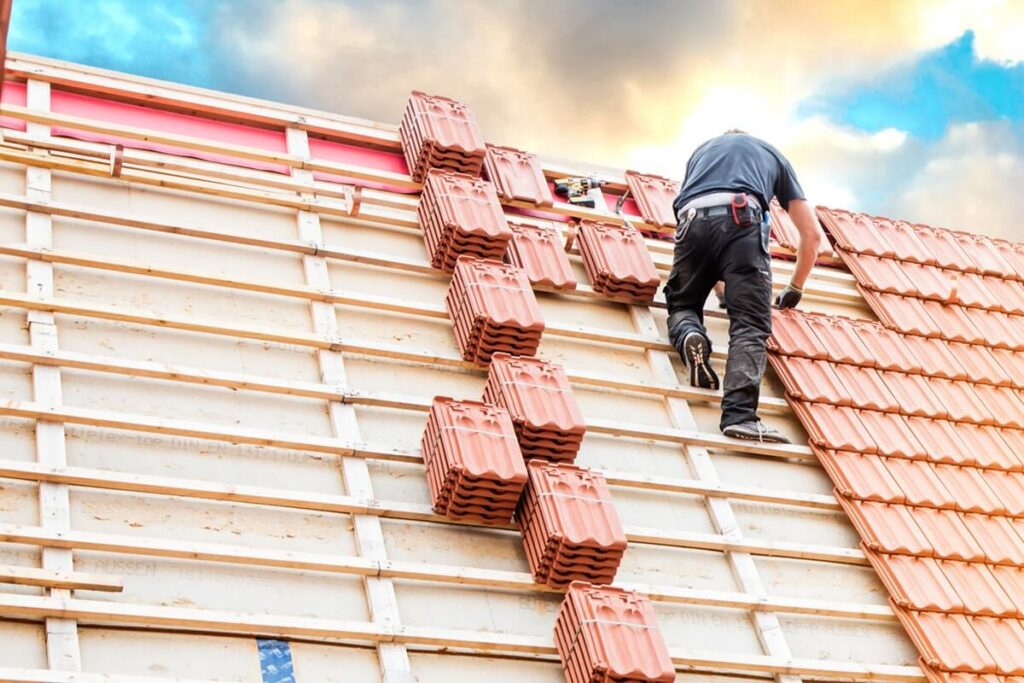 man working on a rooftop