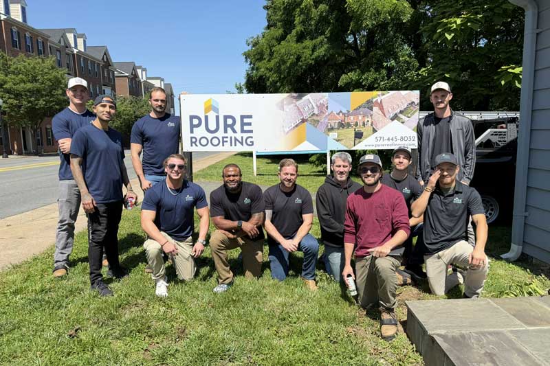 Pure Roofing team members outside the office