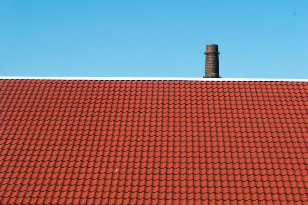 red rooftop in a blue sky