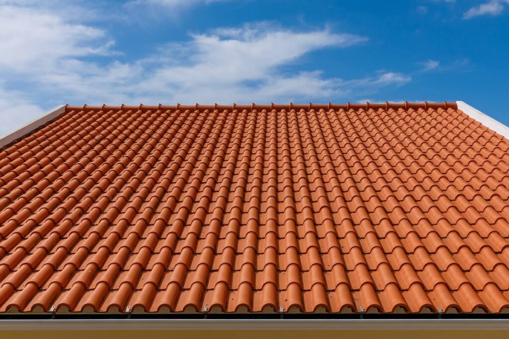 red tiles panels roof under blue sky