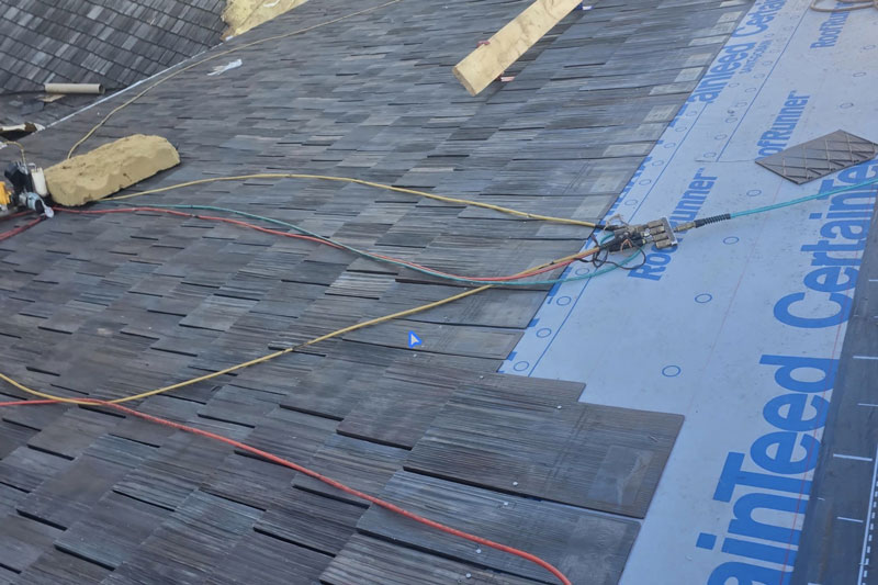 roof singles being installed by a Northern VA emergency roofing contractor