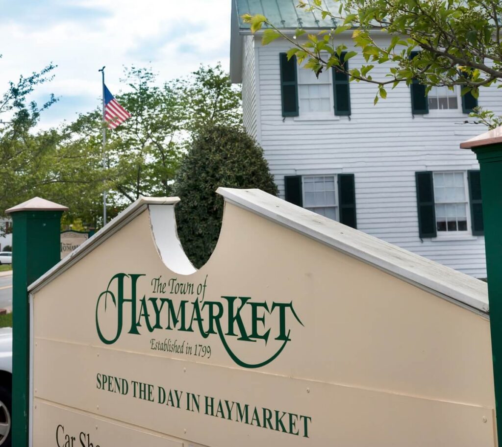 sign in haymarket Virginia with church in background