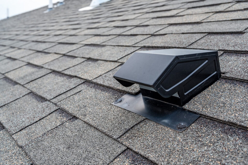 static vent installed on a shingle roof for passive attic ventilation