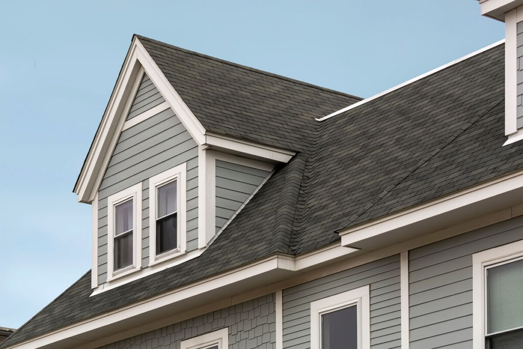 view of a gable-style dormer window on a sloped roof of a newly built family house