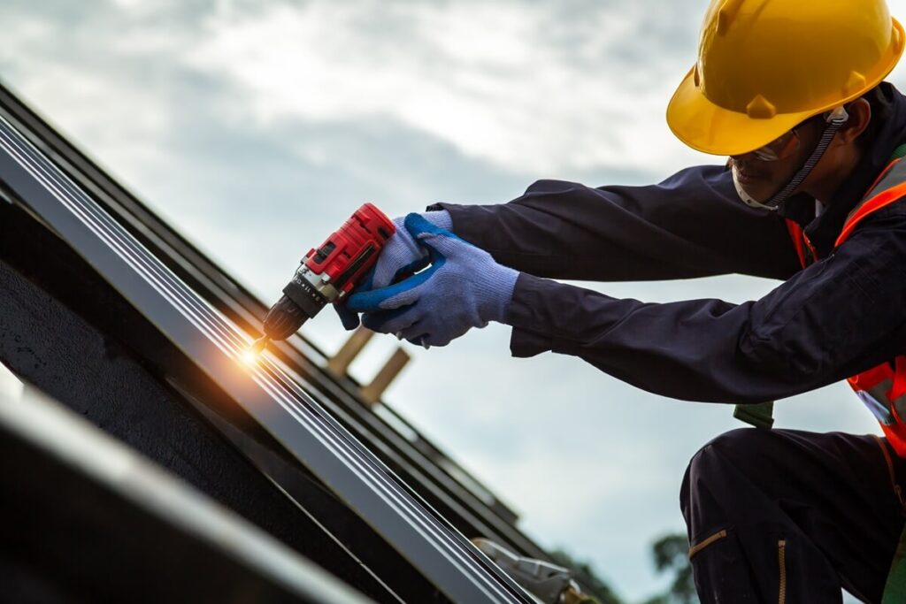 worker in protective uniform wear and gloves