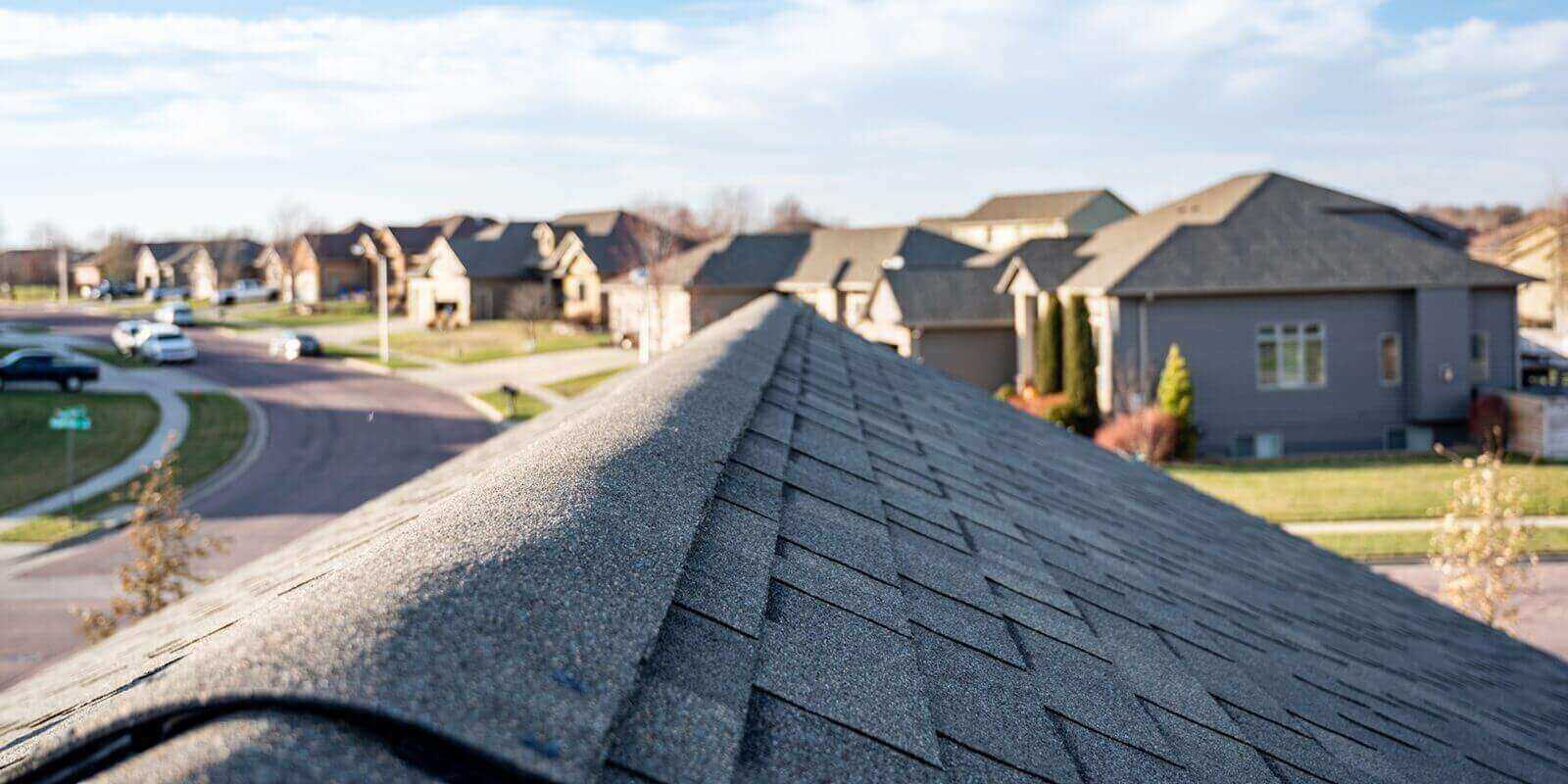 view down the top of an Asphalt shingle roof with ridge cap