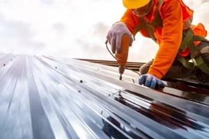 construction worker install new roof