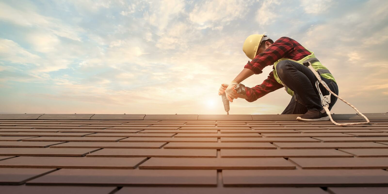roofer working in special protective work wear gloves